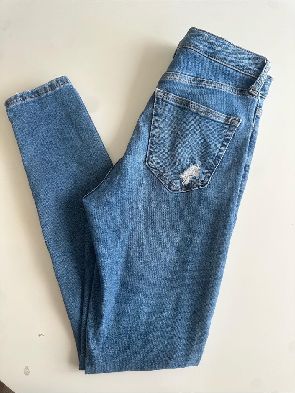 Topshop Mid Blue Skinny Jeans with Back Pocket Distress